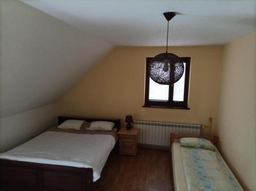 Postel nebo postele na pokoji v ubytování Domek Nad Dunajcem Liptak