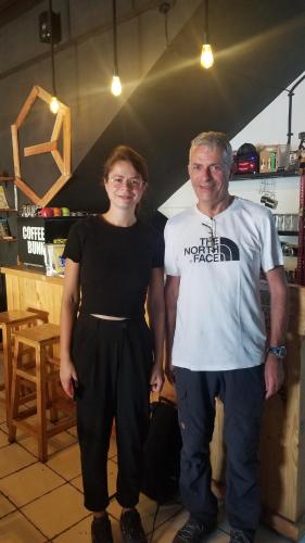 a man and a woman standing next to each other at CoffeeBunk Hostel in Tangerang