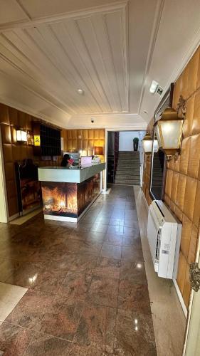 a room with a fireplace in the middle of a building at Hotel Joao Padeiro in Aveiro