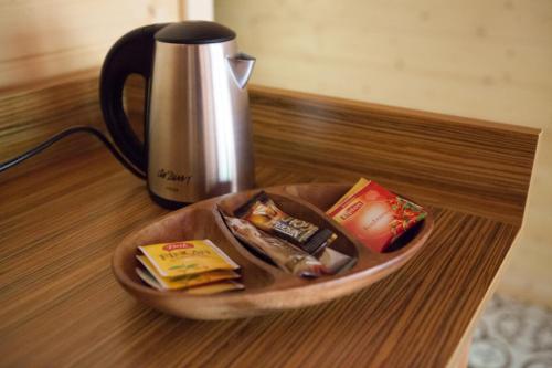 a plate of food on a table next to a kettle at Ekinoks Hotel - Adults Only in Cıralı