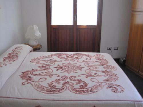 Postel nebo postele na pokoji v ubytování B&B Il Brigante