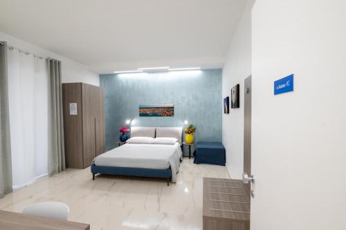 Postel nebo postele na pokoji v ubytování B&B BISCEGLIE