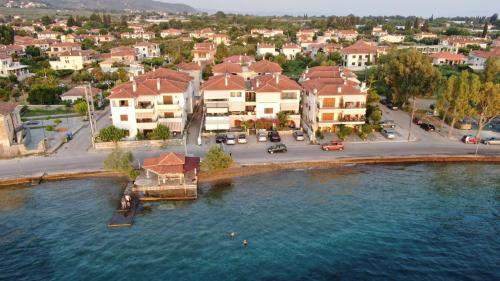 an aerial view of a resort with a large body of water at Mary's Luxury Apartment in Agria