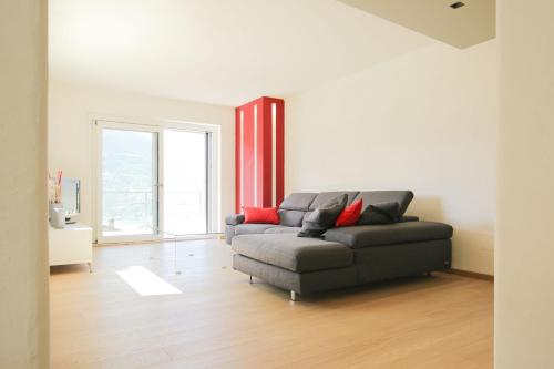 a living room with a couch and a window at Style apartments VdA in Senin