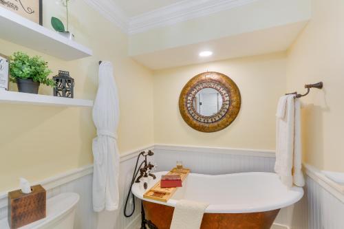 a bathroom with a bath tub and a sink at Rocky Vines Wine Country Retreat with Mountain Views in Leesburg