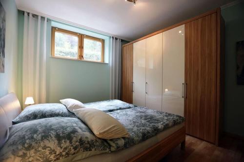 a bedroom with a large bed and a window at Property in Daun in Daun