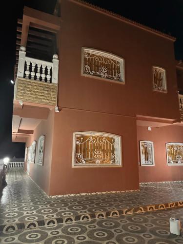 a building with a tile floor in front of it at AYOR FES in El Oulaij