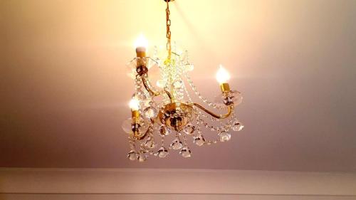 a chandelier hanging from a ceiling at Palazzo Zimatore Residenza D'Epoca in Pizzo