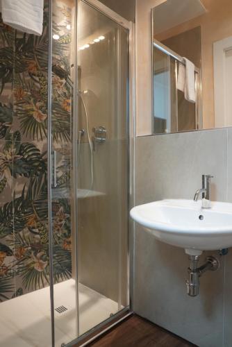 a bathroom with a shower and a sink at Affitta camere Mimi family in Florence