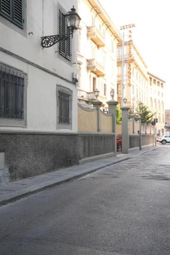 an empty street in front of a building at Mimi family in Florence