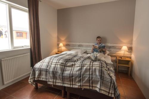 Кровать или кровати в номере Álfheimar Hotel
