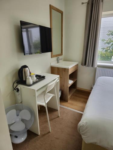 Postel nebo postele na pokoji v ubytování Homefield Lodge