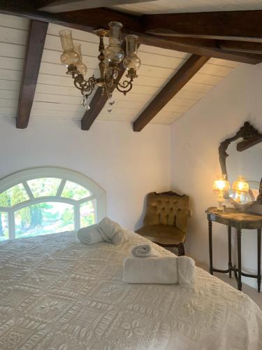 a bedroom with a large bed and a window at ST NIKOLA PANORAMIC SUITES HALKIDIKI in Agios Nikolaos