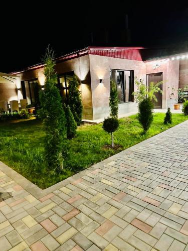 a house with a courtyard at night at Harmony Resort in Tsaghkadzor