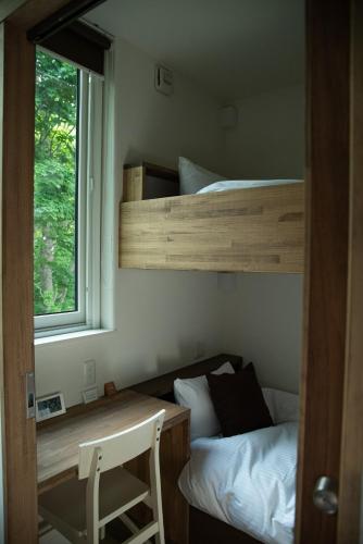 a bedroom with two bunk beds and a window at HOTEL BOTH - Vacation STAY 90935v in Shari