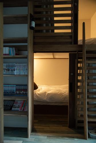 a bedroom with a bunk bed and a book shelf at HOTEL BOTH - Vacation STAY 92324v in Shari