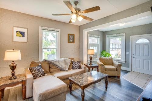 a living room with a couch and chairs and a ceiling fan at Lakefront Mound Getaway Near Snowmobiling Trails! in Mound