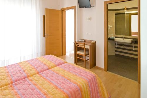 Postel nebo postele na pokoji v ubytování Hotel Ancora
