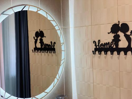 a mirror in a bathroom with a cat wall at Harmony Resort in Tsaghkadzor
