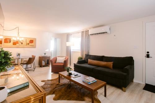 a living room with a couch and a table at Waterfront River Apartments in Rogue River