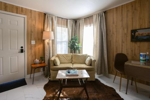 a living room with a couch and a table at Waterfront River Apartments in Rogue River