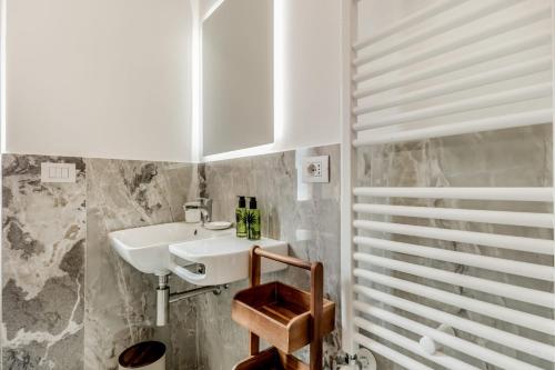 a bathroom with a sink and a mirror at APT ROME - Vittoria Palace in Rome