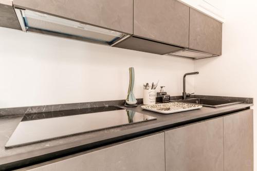 a kitchen with a sink and a counter top at APT ROME - Vittoria Palace in Rome