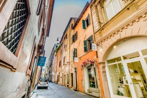 a car driving down a street in an alley at APT ROME - Vittoria Palace in Rome