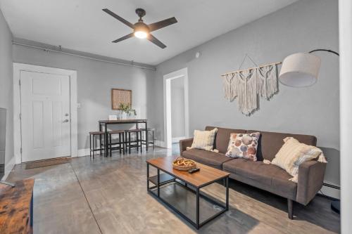 a living room with a couch and a table at Navarre Apartments in Des Moines