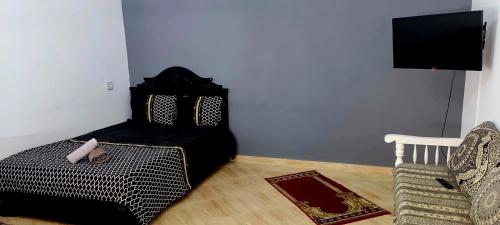 מיטה או מיטות בחדר ב-luxe appartement Nour D'asilah 3 Free WiFi 5G
