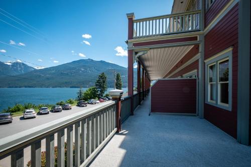 a balcony of a house with a view of a lake at Kaslo Hotel in Kaslo