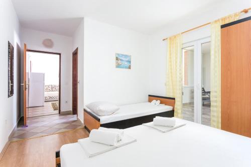 Posteľ alebo postele v izbe v ubytovaní Apartment Podaca 6736b