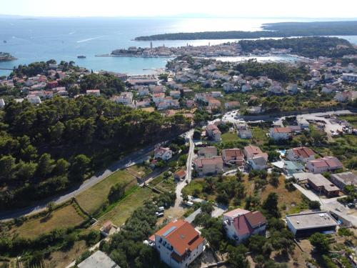 an aerial view of a city and the water at MEMORI bed&breakfast in Rab