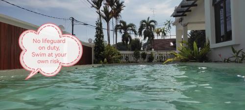 a sign that reads no trapped on only swim at your own house at Yes Muar in Muar