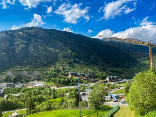 a view of a mountain with a train at Naturaleza En Soldeu - Disfruta En Familia - Parking Gratis l by BonesVacances in Soldeu