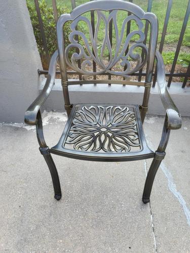 a metal chair sitting on top of a sidewalk at Econolodge in Andalusia