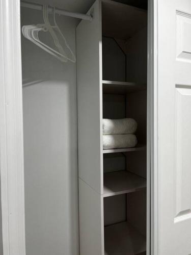 a closet with some white towels in it at Comfy 2 bedroom apartment in Port Richey