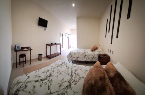 Postel nebo postele na pokoji v ubytování HO Santa María Countryside Hotel Hospedaje