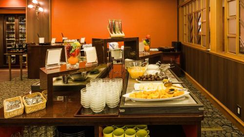 a buffet in a hotel with food on a table at Diamond Arima Onsen Society in Kobe