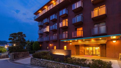 a rendering of a hotel at night at Diamond Arima Onsen Society in Kobe