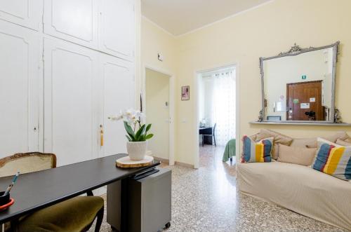 a living room with a table and a couch at Eco B&B Marela in Rome