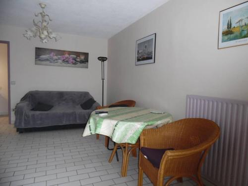 a bedroom with a bed and a table and chairs at Appartement Canet-Plage, 2 pièces, 4 personnes - FR-1-750-6 in Canet-en-Roussillon