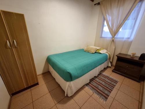 Кровать или кровати в номере Cabañas La Marca
