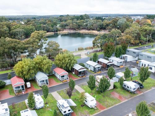 an aerial view of a trailer park with a lake at NRMA Ballarat Holiday Park in Ballarat