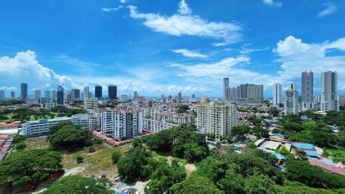 a view of a city with tall buildings at SkyPool with Seaview 8pax Beacon Executive Suites - Georgetown City Centre - 3km to Komtar in George Town