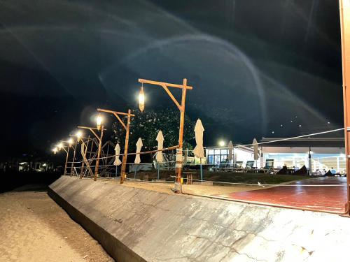 a skateboard ramp at night with lights on it at Aura Samui Best Beach Hotel - SHA Plus in Lamai