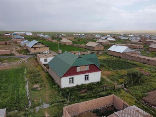 a small village with a red and white house at CBT1 Sary-mogul in Sary-Mogul