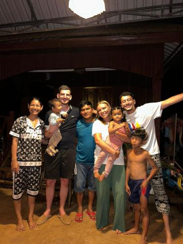 a group of people posing for a picture at Bee Bee's Chalets home stay and trekking in Banlung