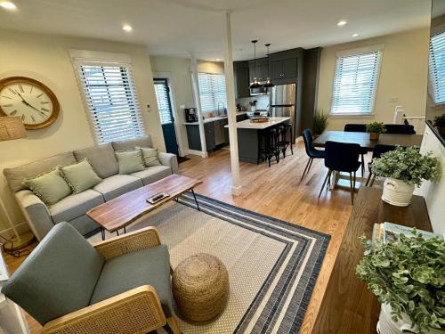 a living room with a couch and a table at Prime Location! Renovated House! 6 Bed4 Bath in Newport