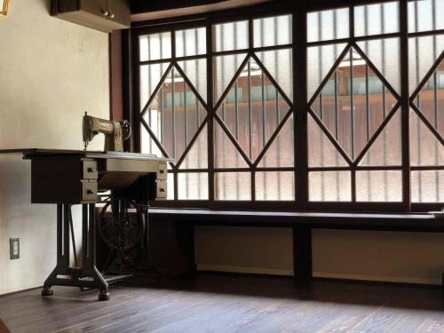 a sewing machine in front of a window at RITA Yame Fukushima in Yame